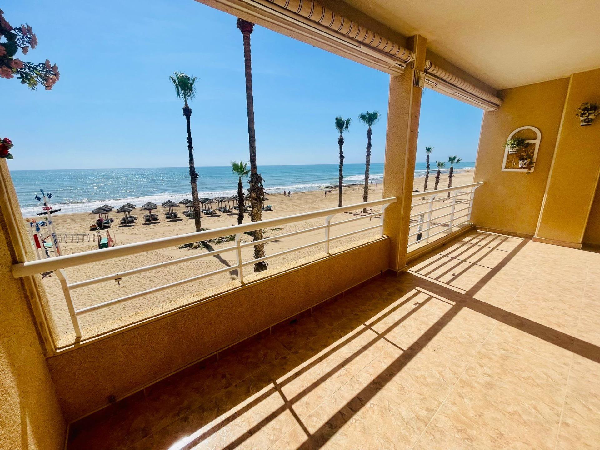 This spectacular first floor apartment is located on the first line of La Playa de La Mata, with imp - Image 1