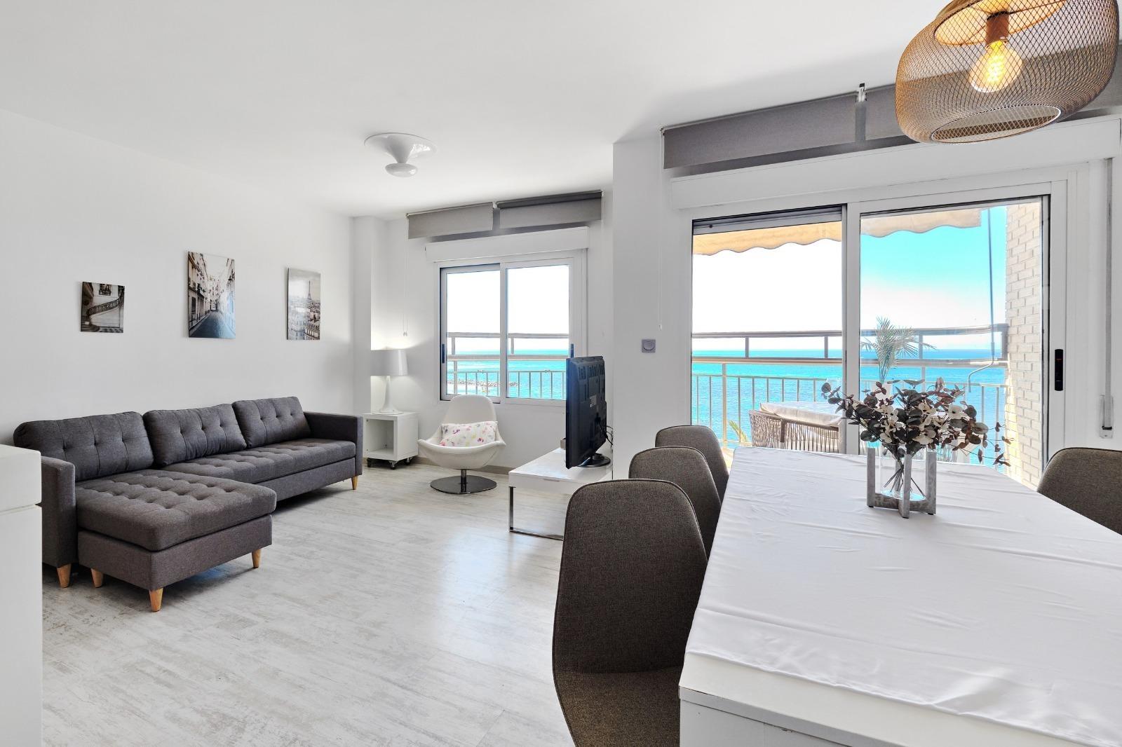 Discover this spectacular 3-bedroom, 2-bathroom apartment located on the beachfront of Playa del Cur - Image 1